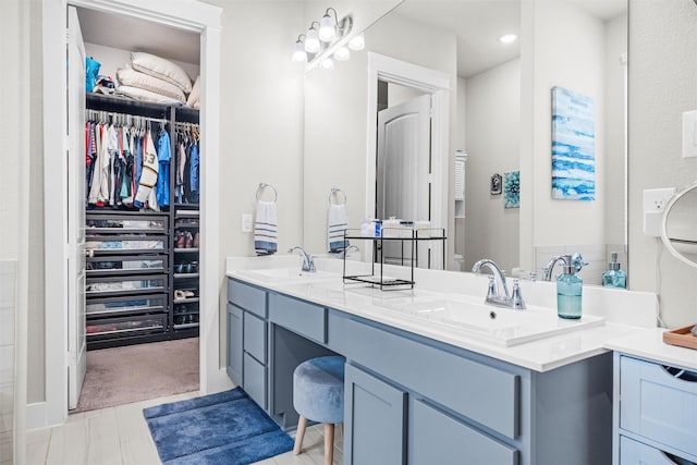 7210 Rustic Rock Rd, Arlington, TX 76001 - full bathroom featuring a sink, a walk in closet, and double vanity