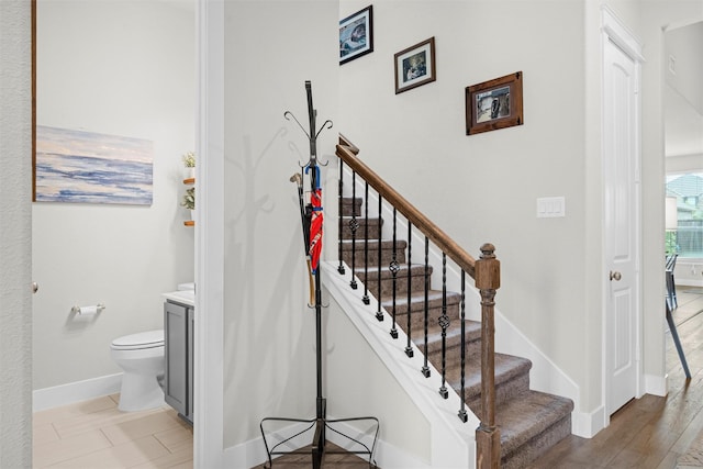 7210 Rustic Rock Rd, Arlington, TX 76001 - staircase featuring baseboards and wood finished floors