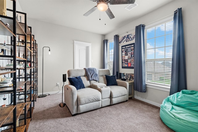 7210 Rustic Rock Rd, Arlington, TX 76001 - sitting room with ceiling fan, plenty of natural light, baseboards, and carpet