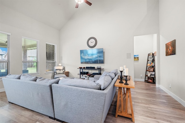 7210 Rustic Rock Rd, Arlington, TX 76001 - living area featuring baseboards, ceiling fan, high vaulted ceiling, and light wood-type flooring
