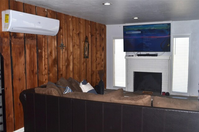 372 Shoreline Dr, Azle, TX 76020 - living room featuring recessed lighting, a brick fireplace, wood walls, and a wall mounted air conditioner