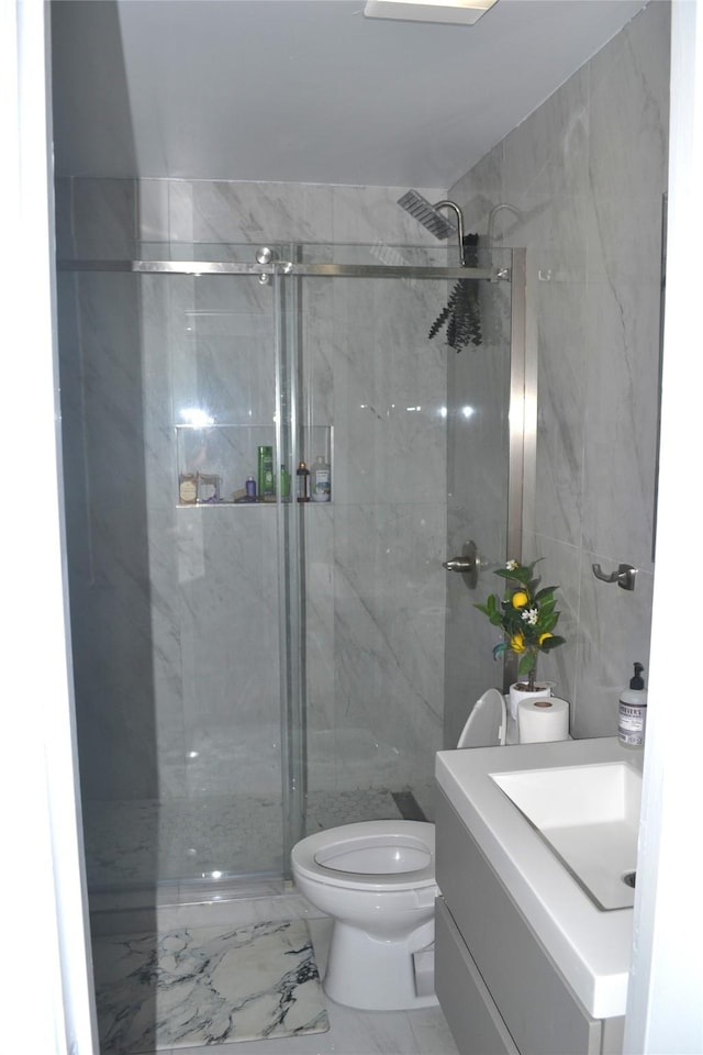 372 Shoreline Dr, Azle, TX 76020 - bathroom with vanity, a shower stall, toilet, and marble finish floor