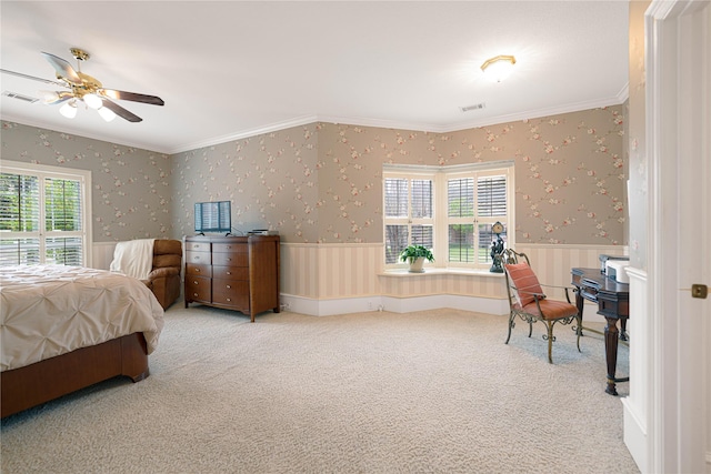 1204 Lakeridge Dr, Ennis, TX 75119 - carpeted bedroom with visible vents, ornamental molding, and a wainscoted wall