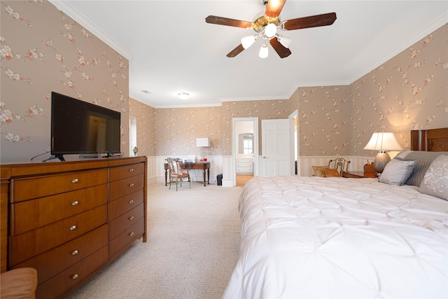1204 Lakeridge Dr, Ennis, TX 75119 - bedroom with wallpapered walls, light colored carpet, wainscoting, and ornamental molding