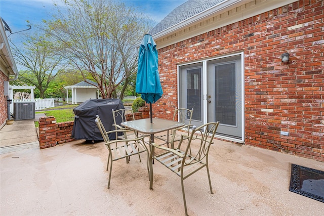 1204 Lakeridge Dr, Ennis, TX 75119 - view of patio with area for grilling, french doors, outdoor dining area, fence, and cooling unit