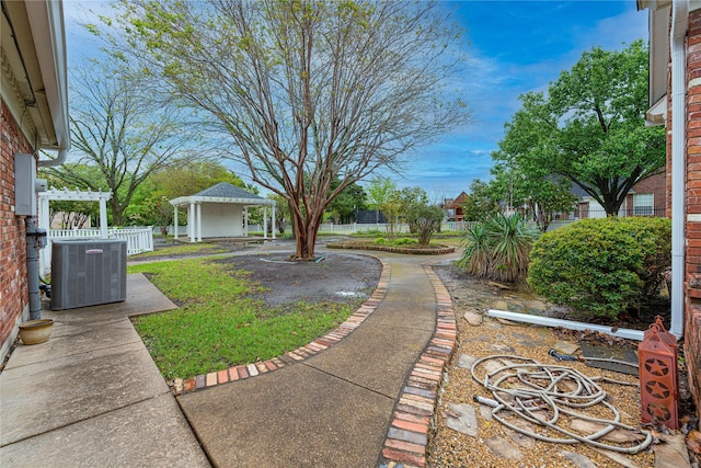 1204 Lakeridge Dr, Ennis, TX 75119 - view of yard featuring a patio area, a gazebo, fence, central AC, and a pergola