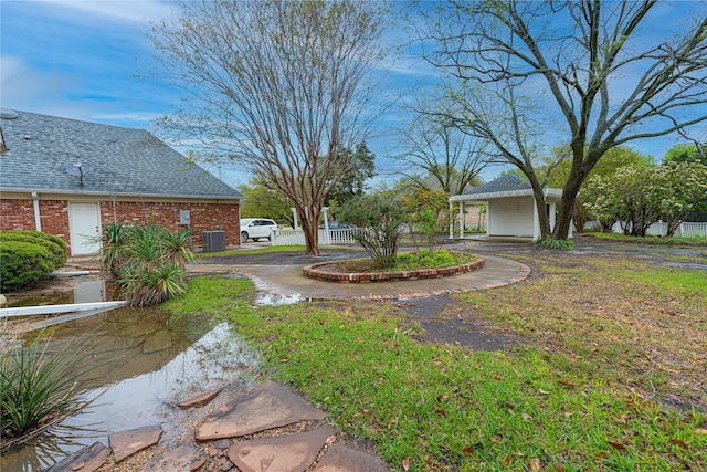 1204 Lakeridge Dr, Ennis, TX 75119 - view of yard featuring central air condition unit and fence