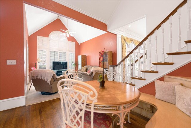 1204 Lakeridge Dr, Ennis, TX 75119 - dining area with ceiling fan, baseboards, wood finished floors, vaulted ceiling, and stairway