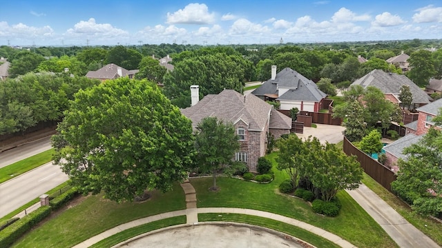 birds eye view of property with a residential view