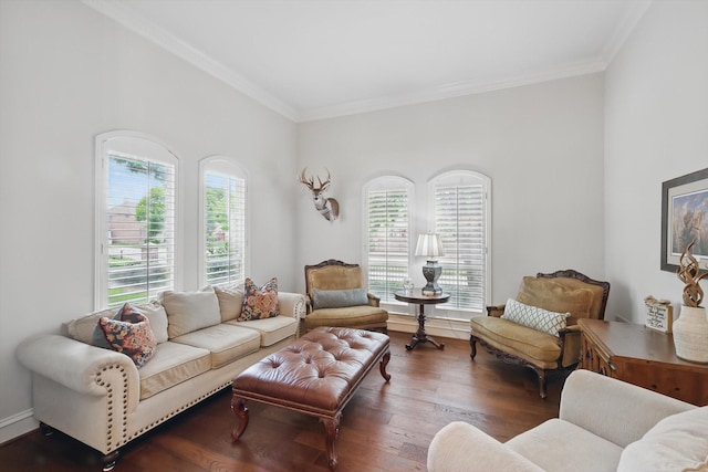 living room with baseboards, ornamental molding, and wood finished floors