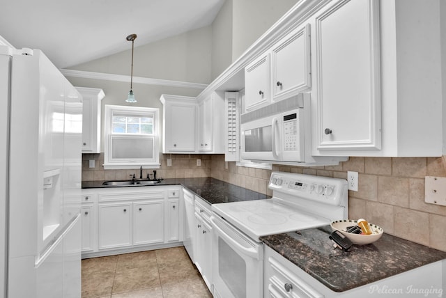 9518 Hackberry Dr, Shreveport, LA 71115 - kitchen with a sink, white cabinets, vaulted ceiling, and white appliances