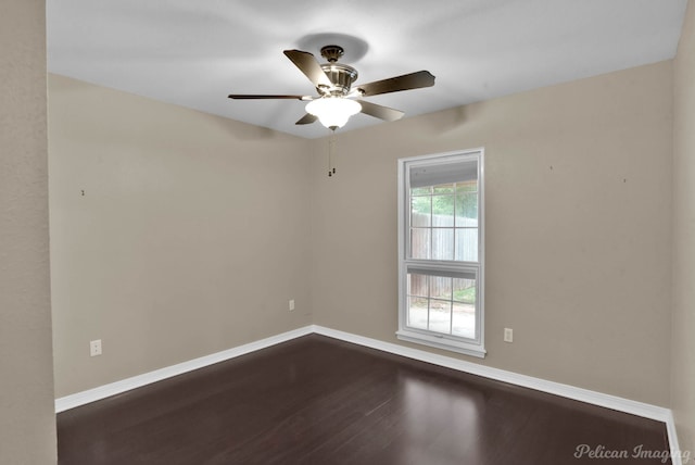 9518 Hackberry Dr, Shreveport, LA 71115 - unfurnished room featuring baseboards, a ceiling fan, and dark wood-style floors