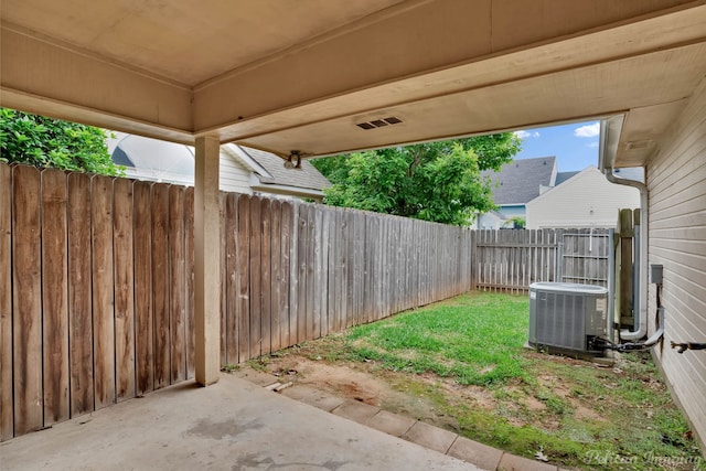 9518 Hackberry Dr, Shreveport, LA 71115 - view of yard featuring central air condition unit, a fenced backyard, and a patio area