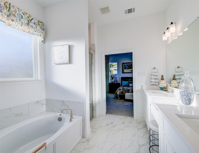 603 E Midway, Euless, TX 76039 - ensuite bathroom featuring connected bathroom, double vanity, visible vents, a bath, and a stall shower