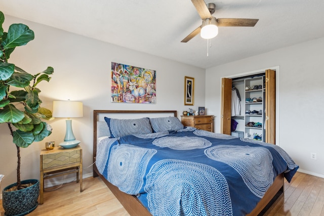 bedroom featuring baseboards, a ceiling fan, and wood finished floors