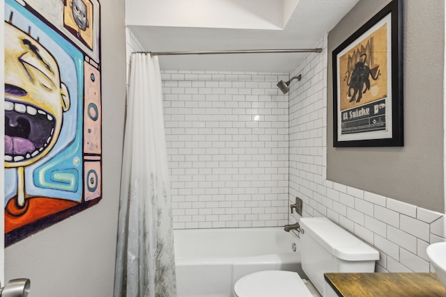 full bath featuring tile walls, toilet, shower / bath combination with curtain, and vanity