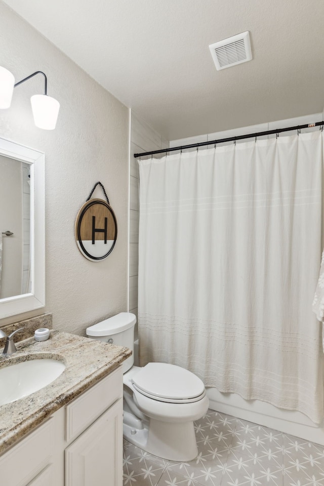 bathroom with vanity, toilet, tile patterned floors, shower / bathtub combination with curtain, and visible vents