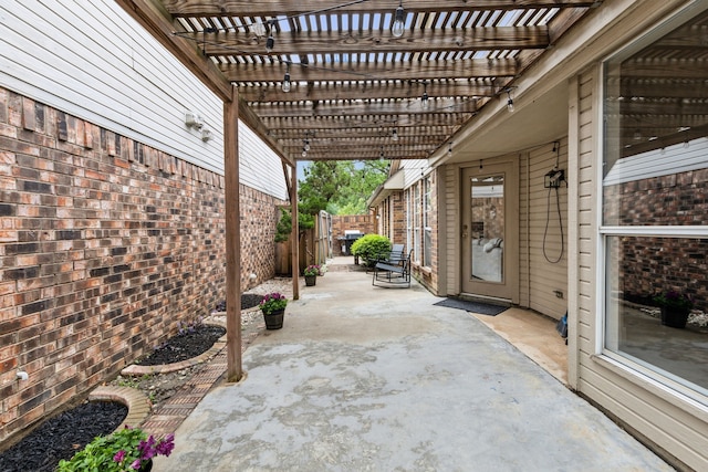 view of patio / terrace featuring a fenced backyard and a pergola