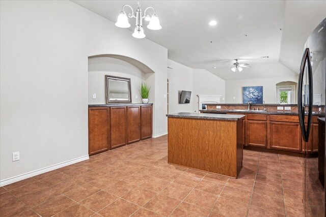 carpeted bedroom featuring a ceiling fan, baseboards, and vaulted ceiling