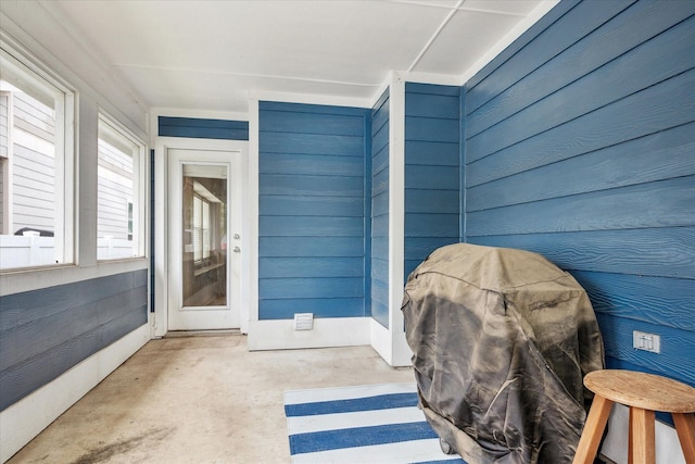 rear view of property with a lawn, a shingled roof, an attached garage, and a fenced backyard