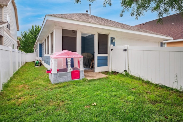 view of yard with a fenced backyard