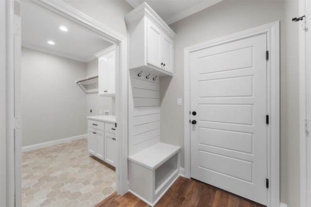 mudroom with crown molding, recessed lighting, baseboards, and wood finished floors