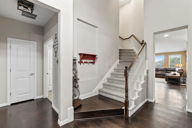 stairway with visible vents, recessed lighting, baseboards, and hardwood / wood-style flooring