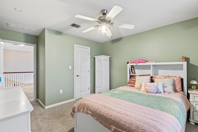 bedroom featuring carpet flooring, a ceiling fan, baseboards, and visible vents