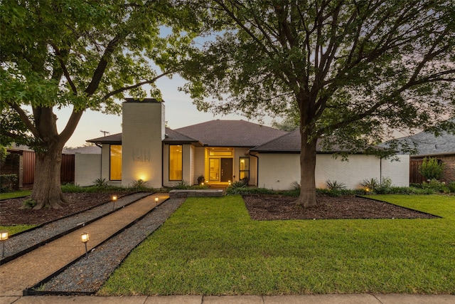 16114 Shadybank Dr, Dallas, TX 75248 - view of front of home featuring a front lawn, fence, a chimney, brick siding, and a shingled roof