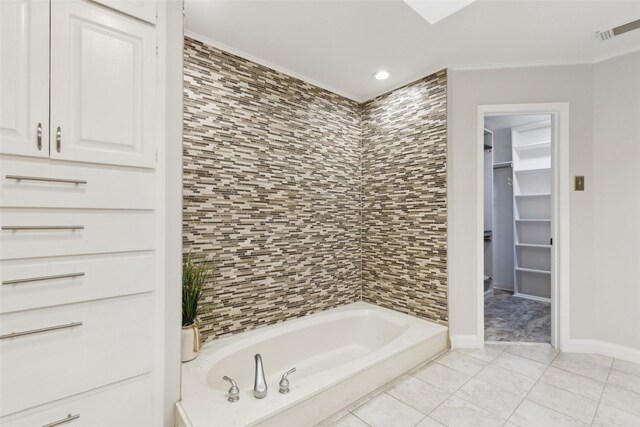 16114 Shadybank Dr, Dallas, TX 75248 - bathroom with visible vents, crown molding, a bathing tub, baseboards, and tile patterned floors