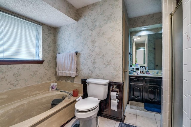 full bath featuring tile patterned flooring, vanity, a garden tub, toilet, and wallpapered walls