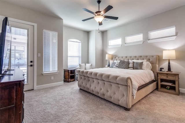 8210 Laflin Ln, Dallas, TX 75231 - bedroom with light carpet, multiple windows, and baseboards