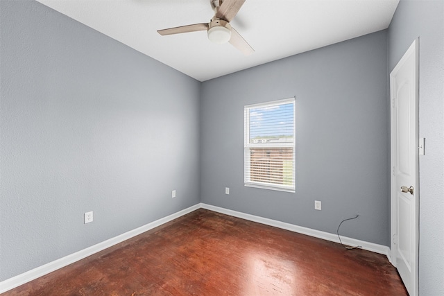 unfurnished room with baseboards and a ceiling fan