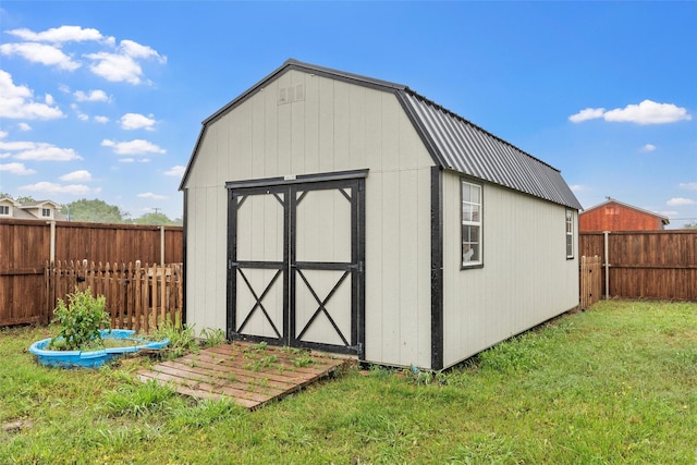 view of shed featuring a fenced backyard