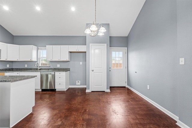 kitchen with baseboards, a notable chandelier, concrete flooring, and dishwasher