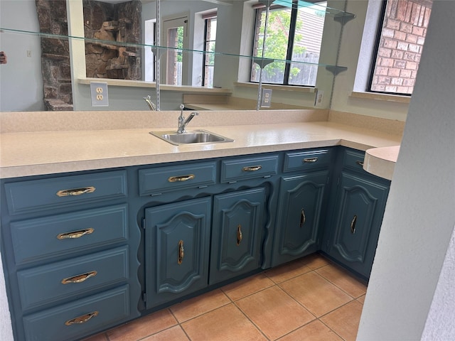 interior space with vanity and tile patterned flooring