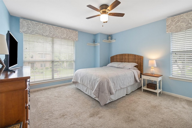 bedroom with carpet floors, baseboards, and ceiling fan