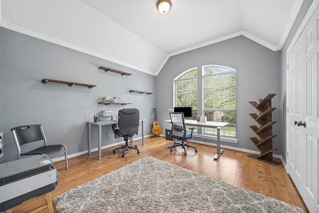 office featuring crown molding, baseboards, wood finished floors, and lofted ceiling