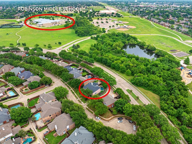 birds eye view of property featuring a water view and a residential view