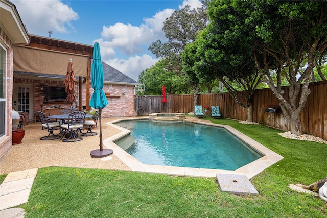 view of pool with a lawn, a fenced backyard, a patio area, and a pool with connected hot tub
