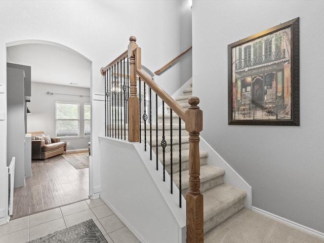 1646 Country Hls, Waxahachie, TX 75165 - staircase with baseboards, arched walkways, and tile patterned flooring