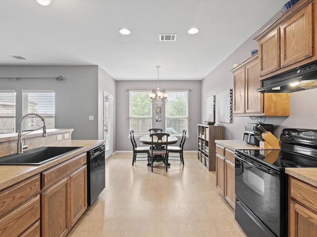 1646 Country Hls, Waxahachie, TX 75165 - kitchen featuring a notable chandelier, a sink, light countertops, under cabinet range hood, and black appliances