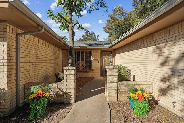 property entrance with brick siding