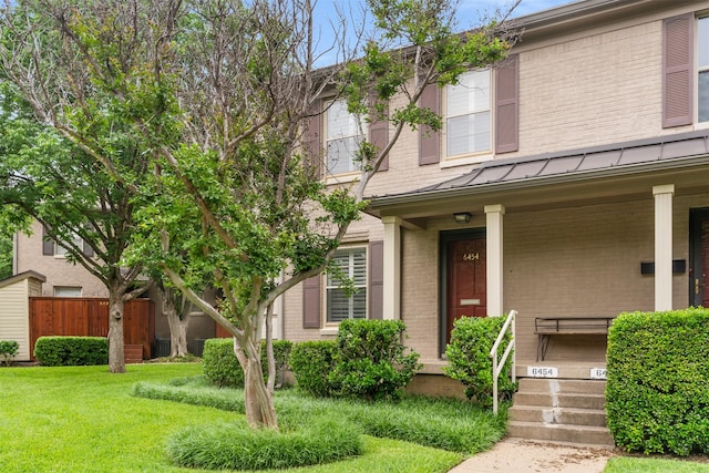 6454 Bordeaux Ave Unit 6454, Dallas, TX 75209 - view of front of property with a front lawn, fence, covered porch, a standing seam roof, and brick siding