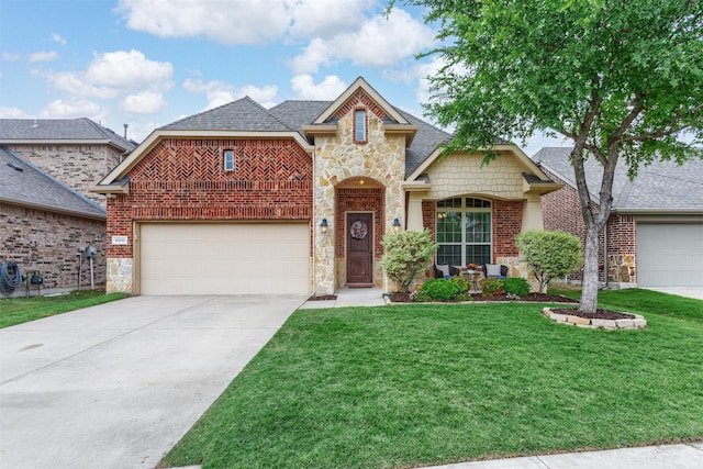view of front of home with a front lawn, stone siding, roof with shingles, brick siding, and concrete driveway