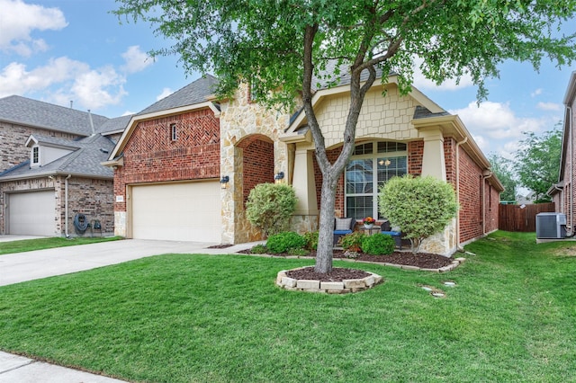 view of front of house with a front lawn, fence, brick siding, central AC unit, and concrete driveway