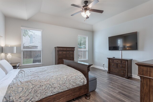 bedroom with baseboards, ceiling fan, and wood finished floors