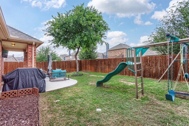 view of yard with a playground, a patio, an outdoor living space, and a fenced backyard