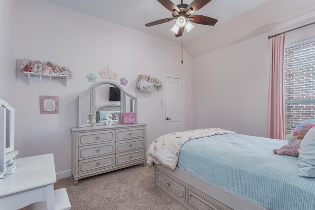 bedroom with a ceiling fan, light colored carpet, and lofted ceiling