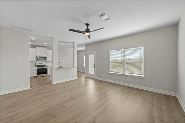 1105 Dye Blvd, Princeton, TX 75407 - unfurnished living room with ceiling fan, visible vents, baseboards, light wood-style floors, and recessed lighting
